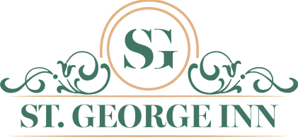 Logo of St. George Inn featuring stylized initials "SG" and intricate design elements.